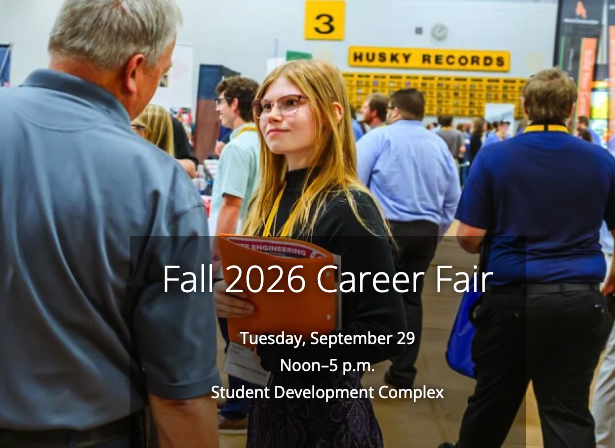 Students wearing yellow lanyards stand in lines and shake hands with recruiters inside a large indoor venue.