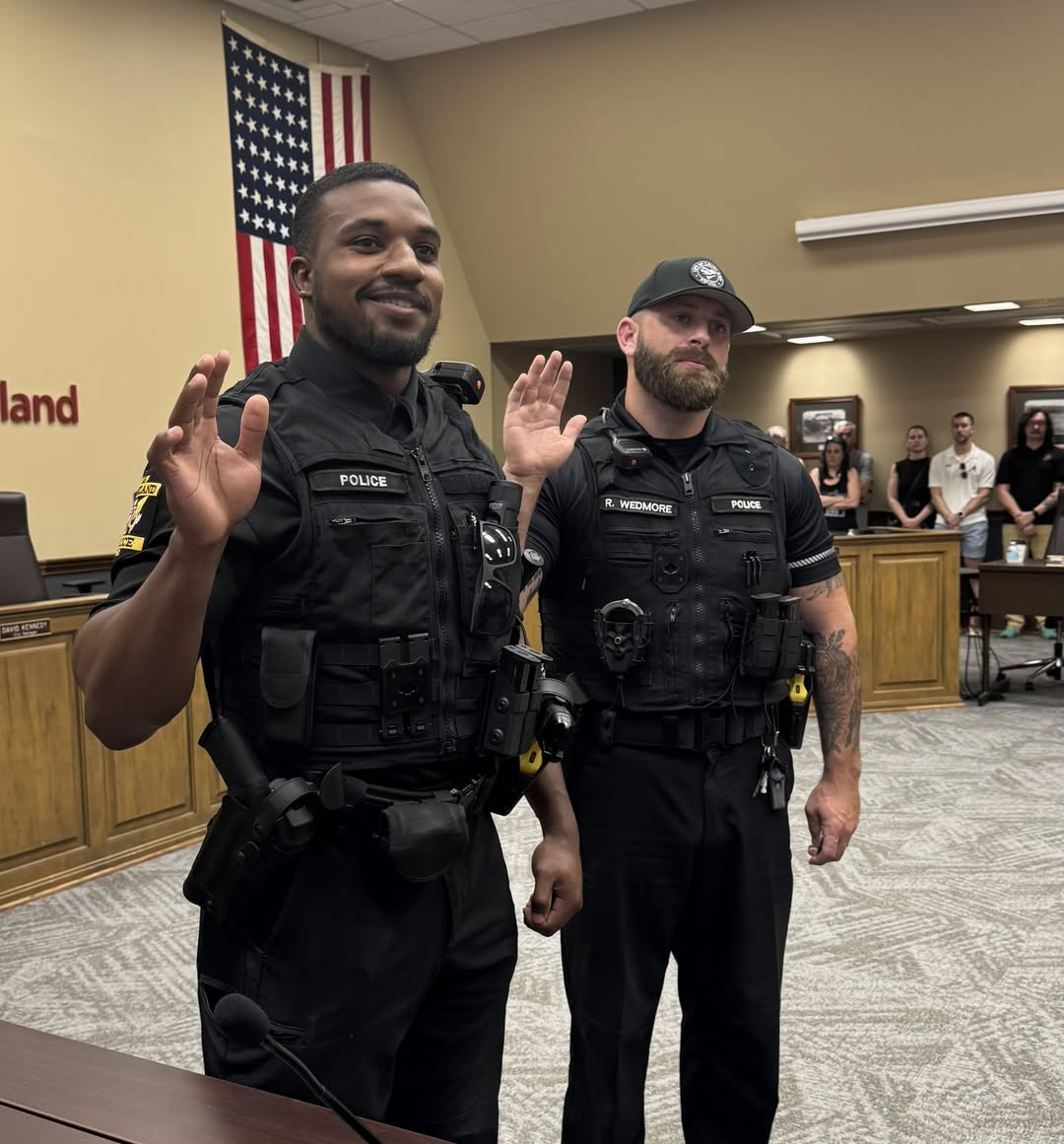 two police officers taking oath