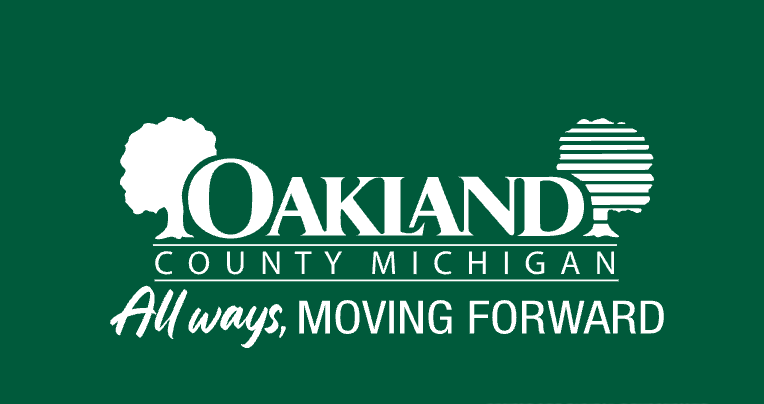 White Oakland County, Michigan, logo on a dark green background.