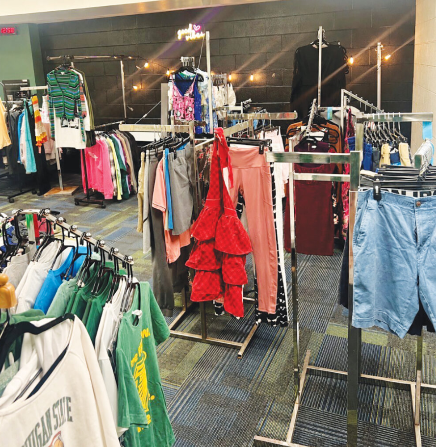 Donated clothing and household items displayed for Groves High School's The One Love Project upcycle boutique.