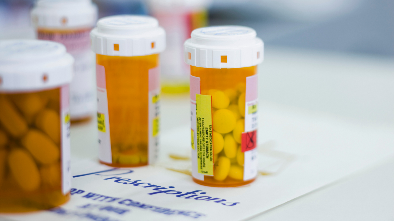 Prescriptions filled in bottle at pharmacy.