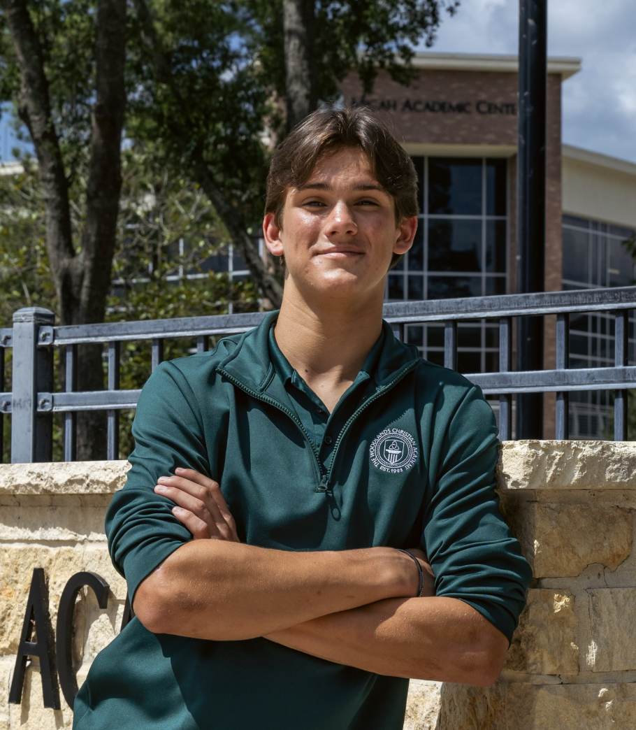 Quinn Conrey, a senior at The Woodlands Christian Academy, stands on campus in TWCA athletic gear.