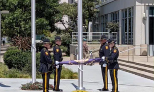 San Mateo County Sheriff's Office Honor Guard raises the Purple Heart flag at County Center in Redwood City.