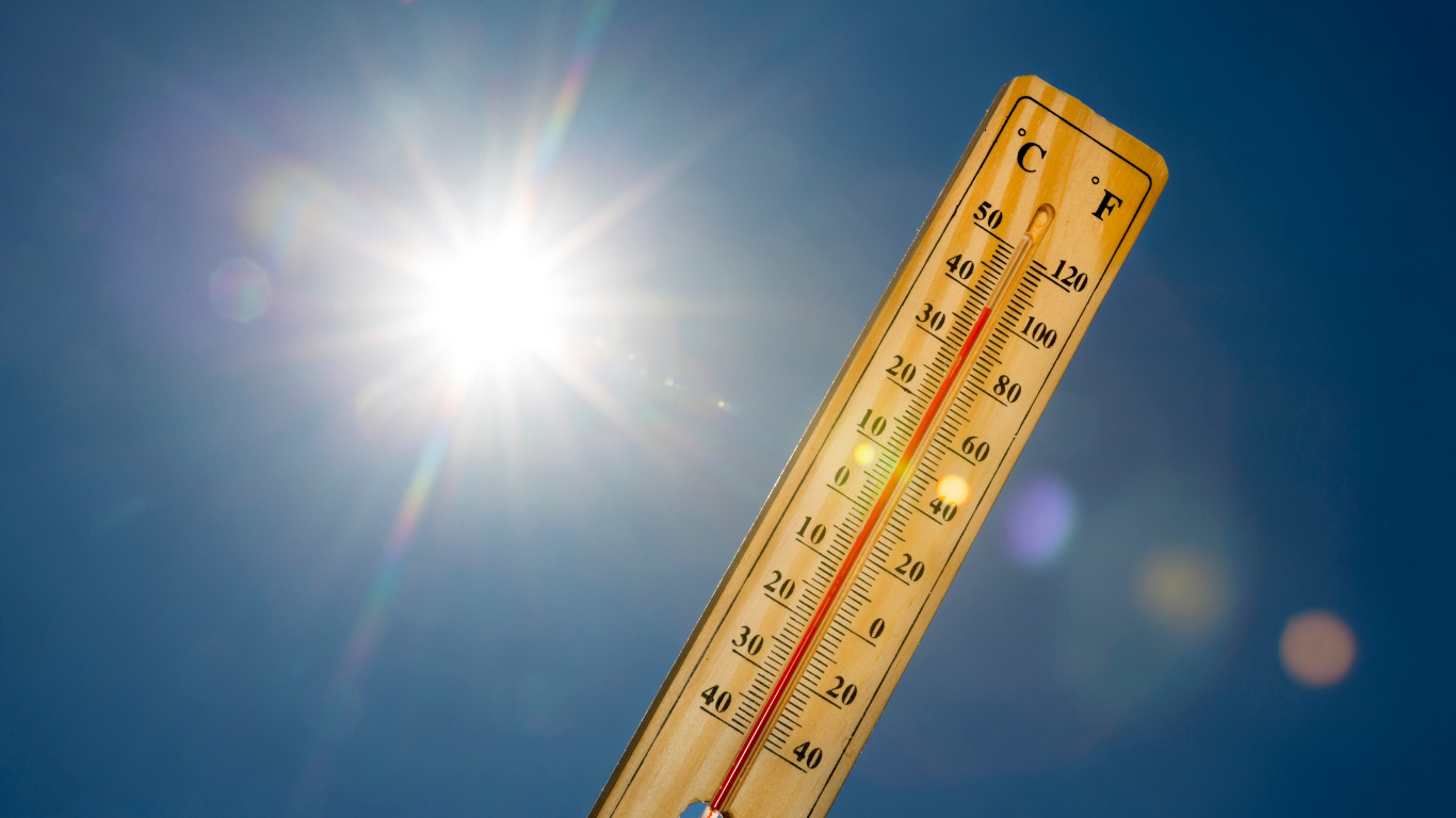 Thermometer showing extreme heat conditions exposed to sunlight