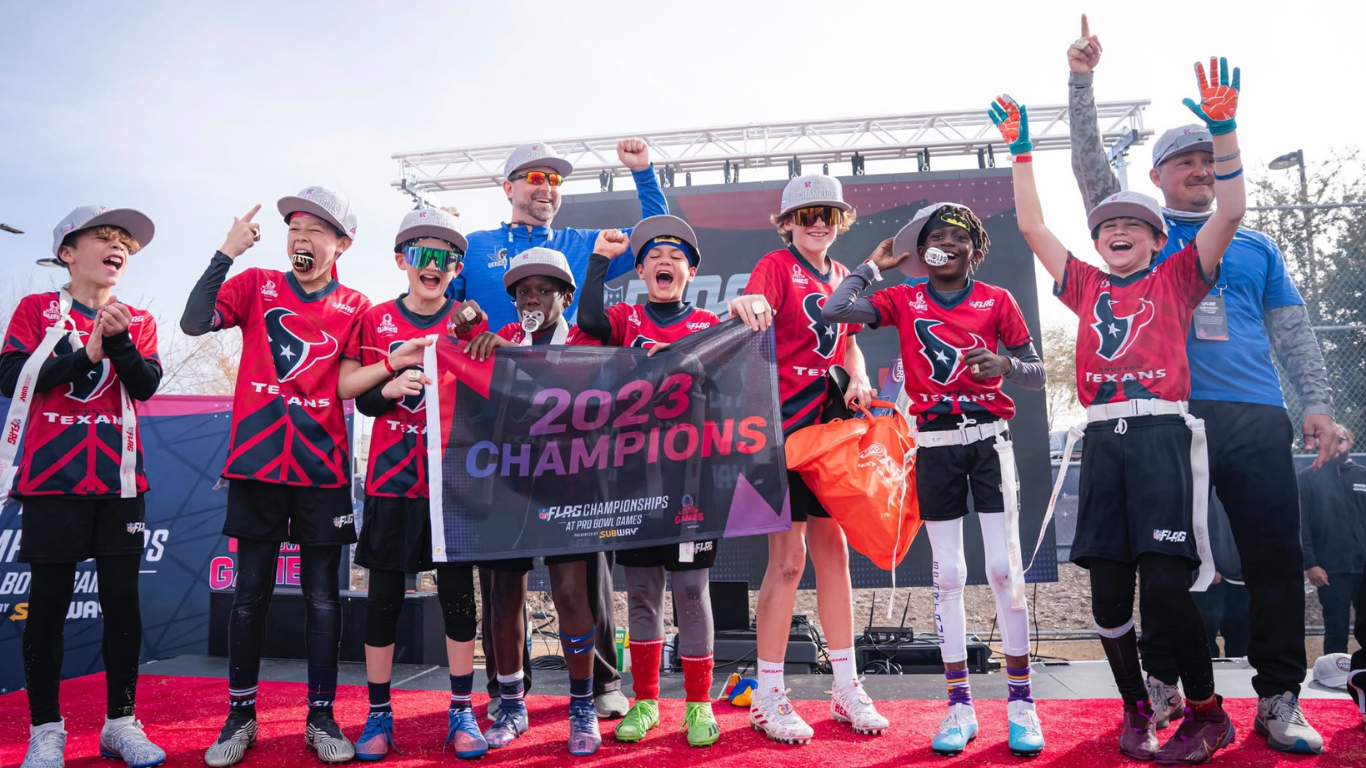 Boys cheering holding flag for championship win