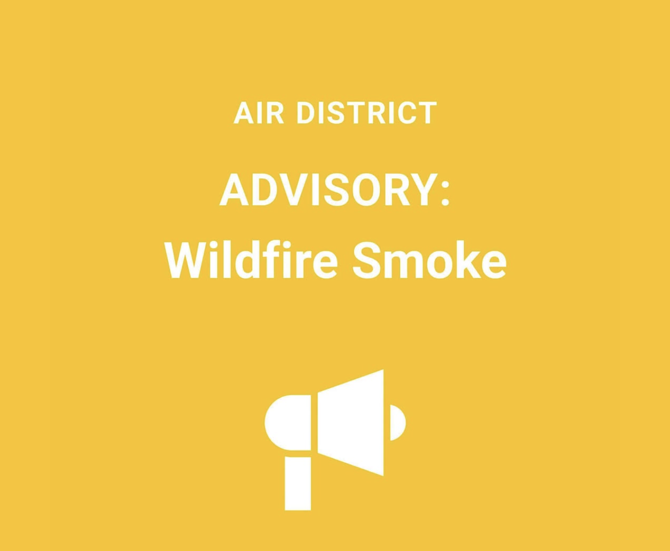 A yellow graphic from the Bay Area Air District reading "Air District Advisory: Wildfire Smoke."